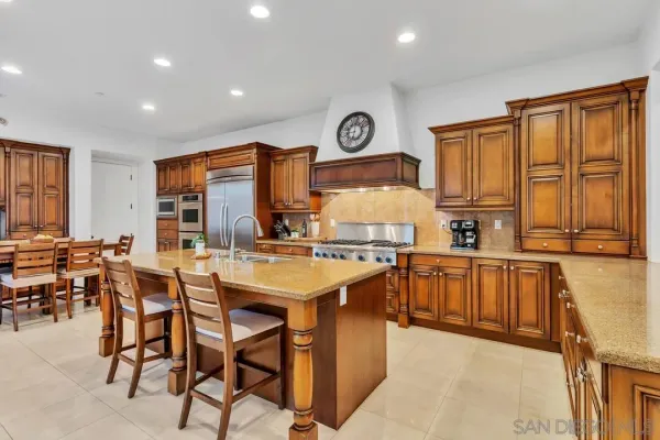 a kitchen with lots of counter top space and appliances