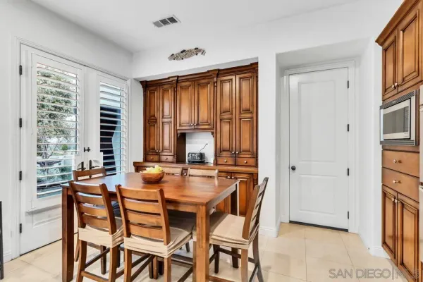 a dining room with furniture and window