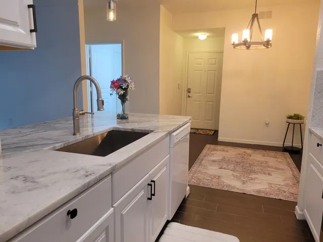 a stove top oven sitting inside of a kitchen