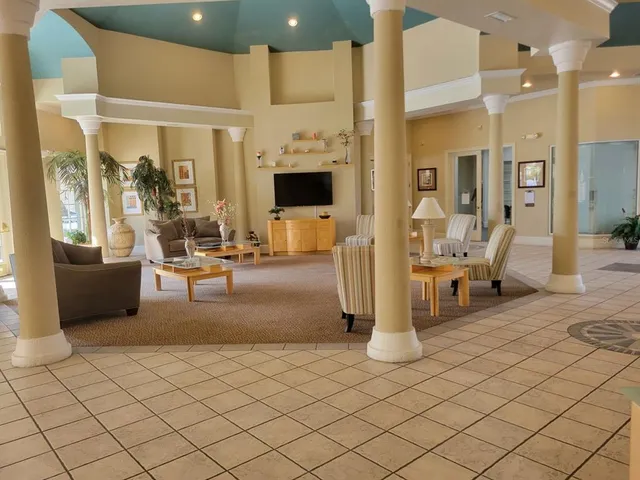 a large kitchen with a table and chairs
