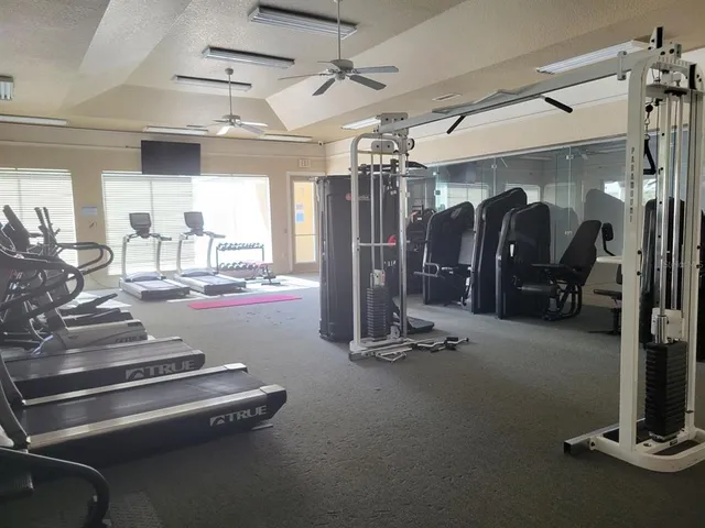 a view of a swimming pool with outdoor seating