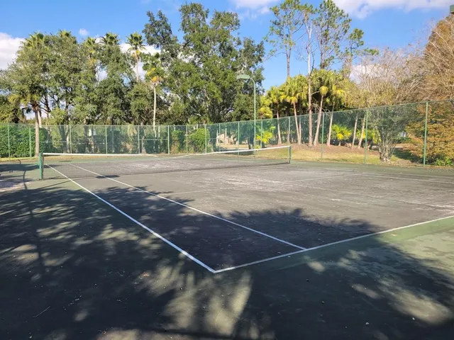 a sign that is sitting in front of flowers
