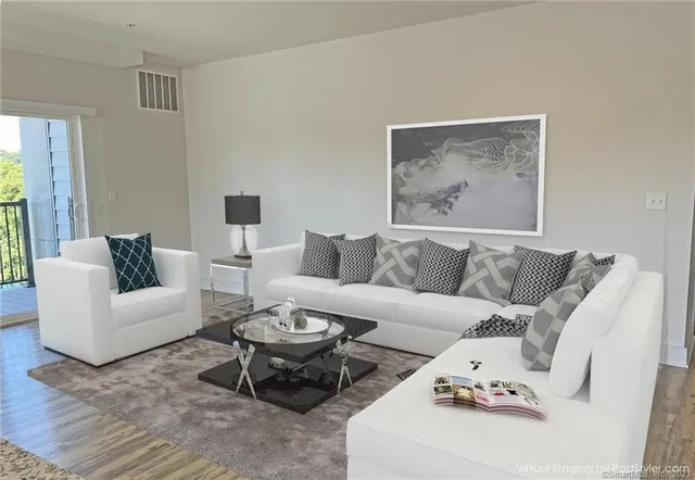 a living room with furniture a rug and a couch