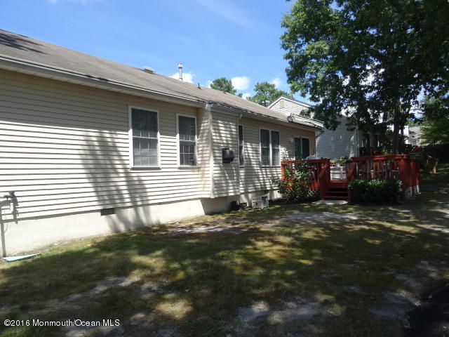 109 Castaway Road Manahawkin, NJ 08050 - Photo 24 of 25 a view of a house with a yard