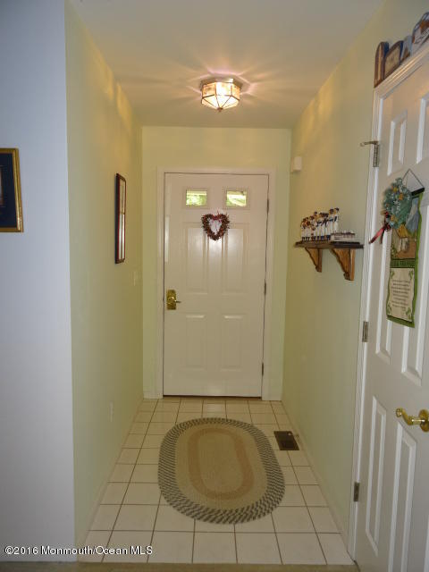 109 Castaway Road Manahawkin, NJ 08050 - Photo 3 of 25 a bathroom with a granite countertop sink a mirror and shower