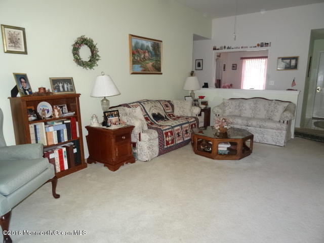 109 Castaway Road Manahawkin, NJ 08050 - Photo 5 of 25 a living room with furniture and a couch