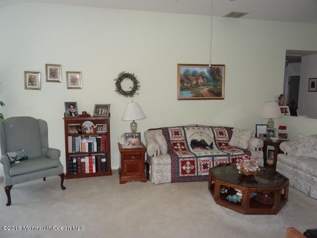 109 Castaway Road Manahawkin, NJ 08050 - Photo 6 of 25 a living room with furniture