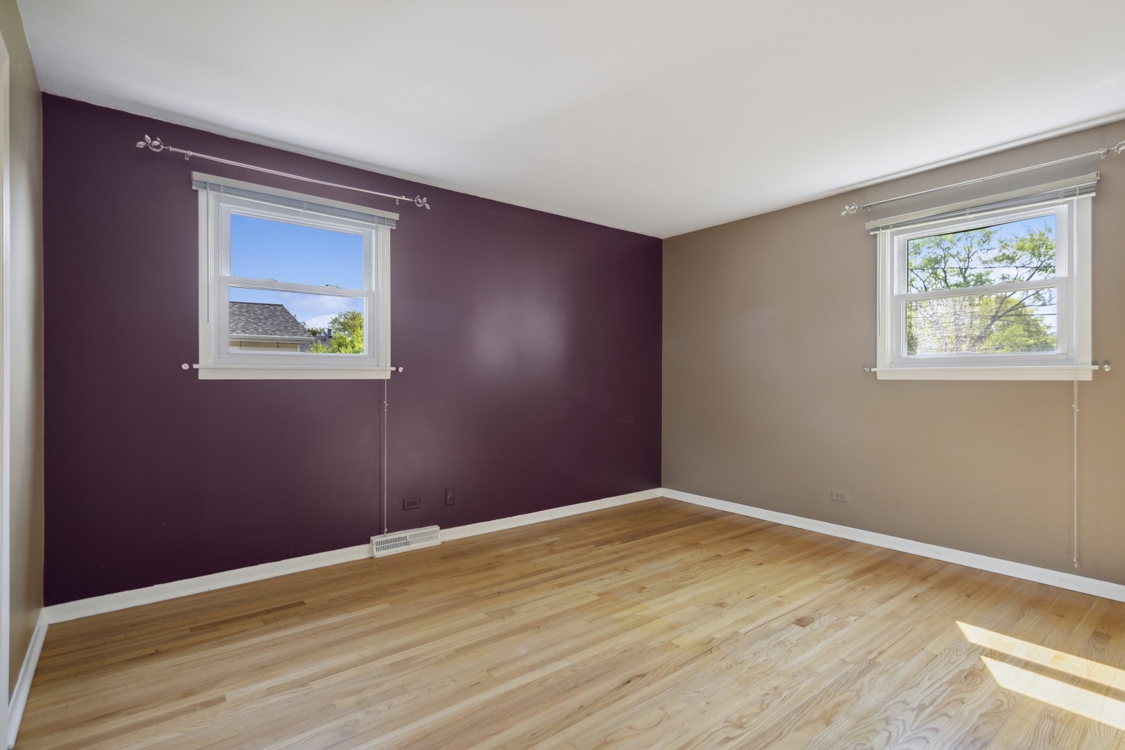 1025 Timber Lane Darien, IL 60561 - Photo 11 of 17 a view of an empty room with wooden floor and a window