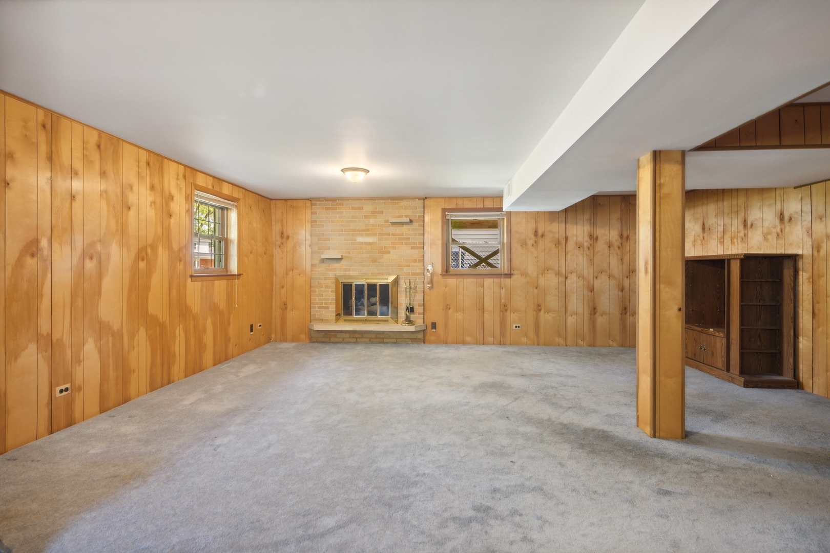 1025 Timber Lane Darien, IL 60561 - Photo 15 of 17 a view of an empty room with a fireplace and a window