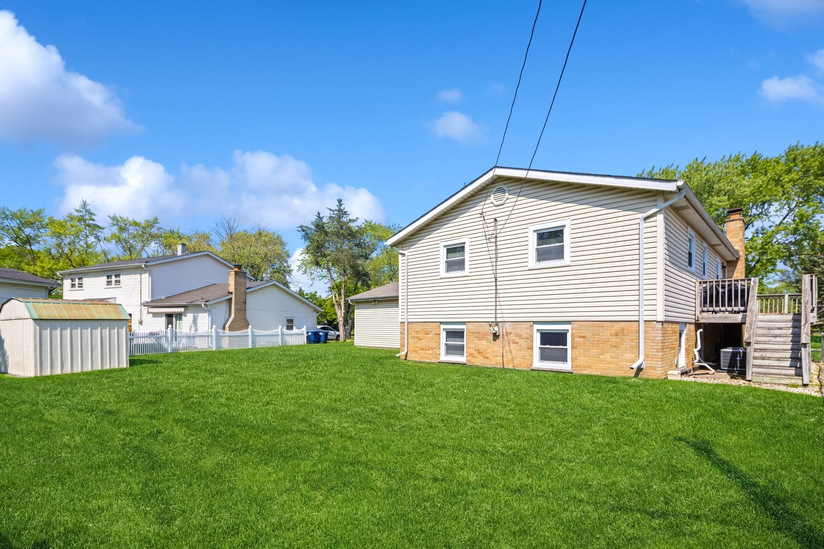 1025 Timber Lane Darien, IL 60561 - Photo 17 of 17 a view of a house with a yard and sitting area