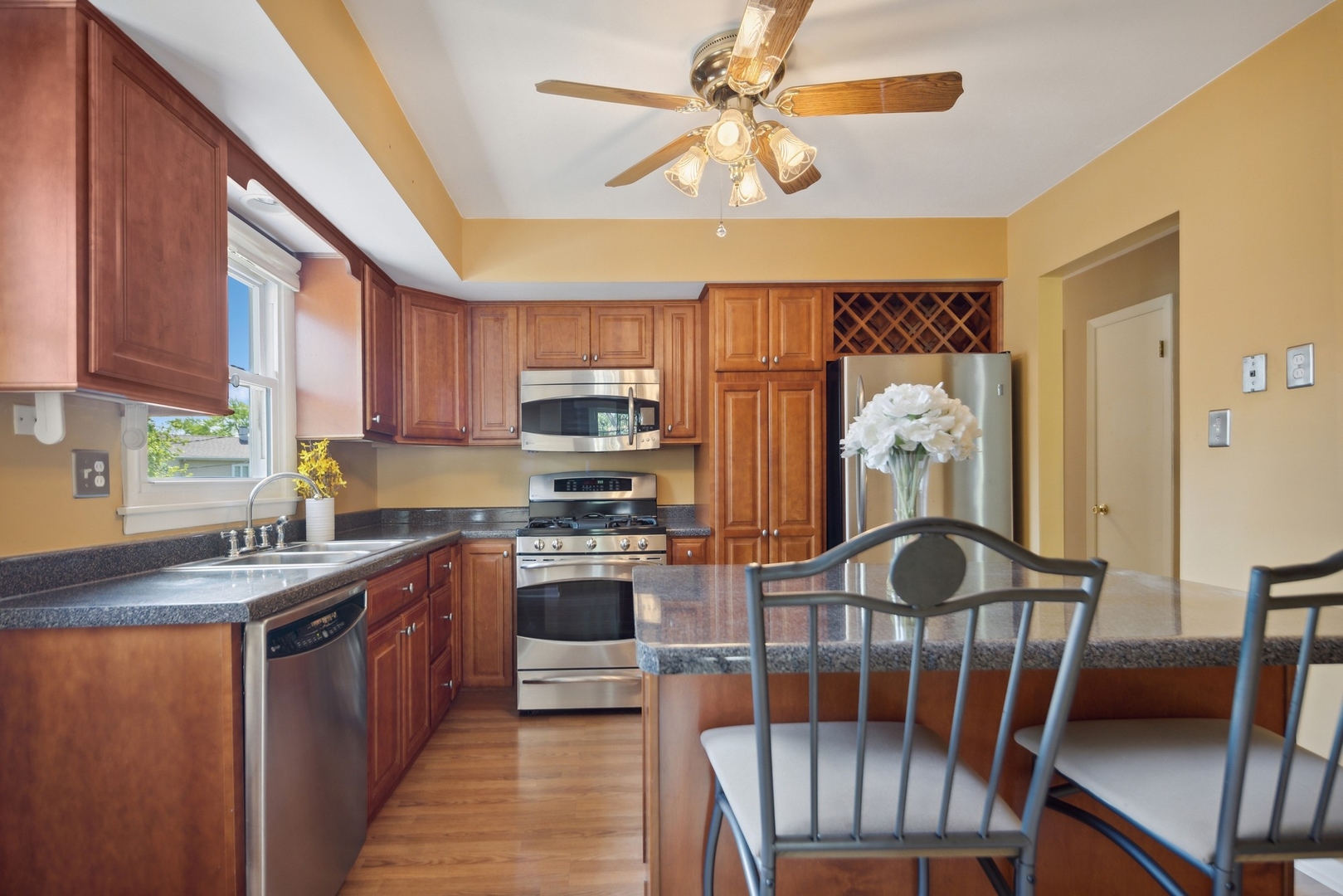 1025 Timber Lane Darien, IL 60561 - Photo 6 of 17 a kitchen with stainless steel appliances granite countertop a stove a sink dishwasher and a refrigerator