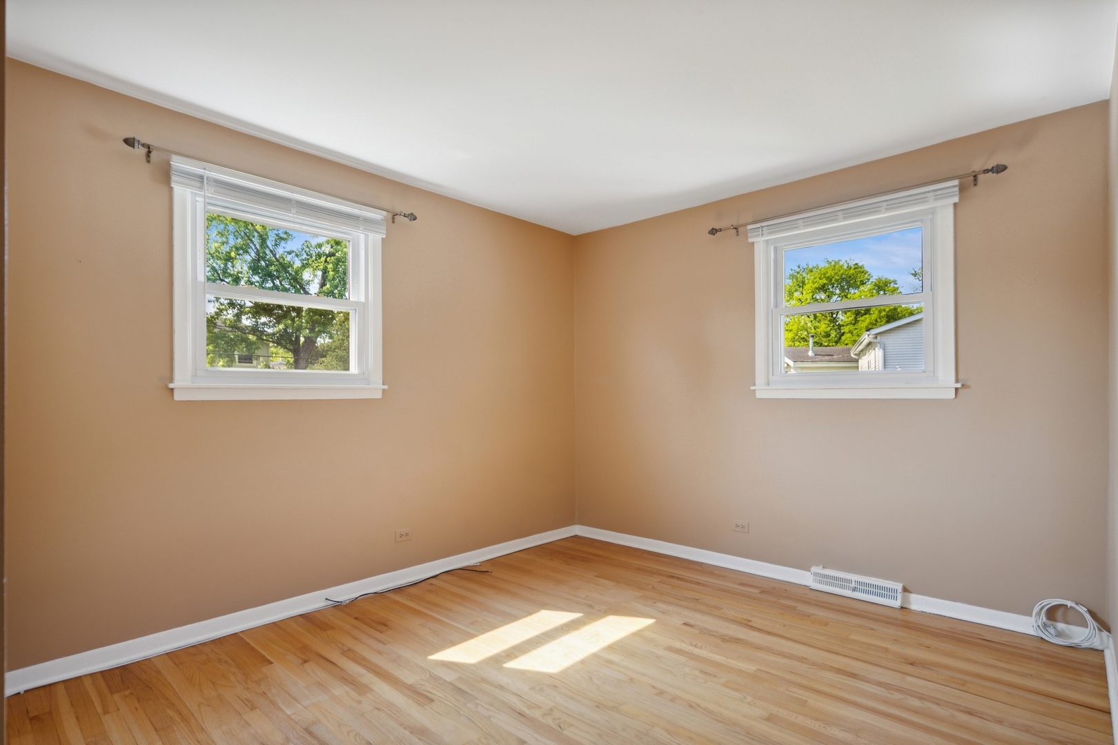 1025 Timber Lane Darien, IL 60561 - Photo 9 of 17 a view of room with window and wooden floor