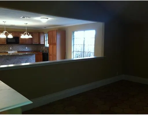 a view of kitchen with cabinets