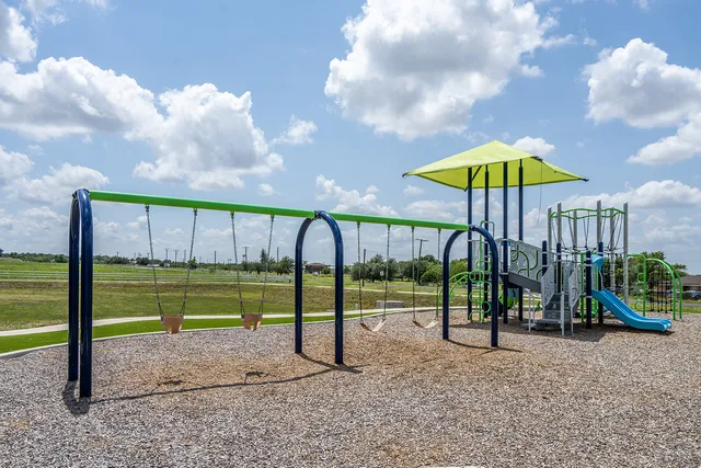 a view of a park with a slide