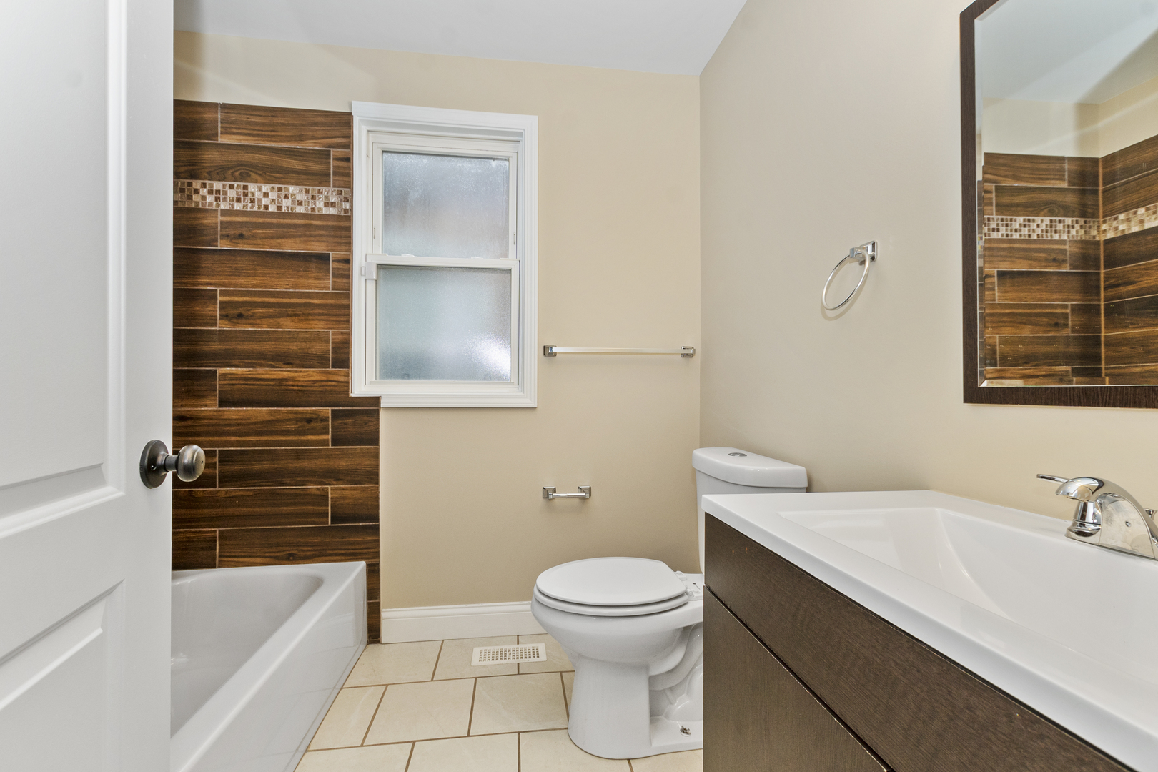 8317 South Merrill Avenue Chicago, IL 60617 - Photo 12 of 23 a bathroom with a sink a toilet and shower