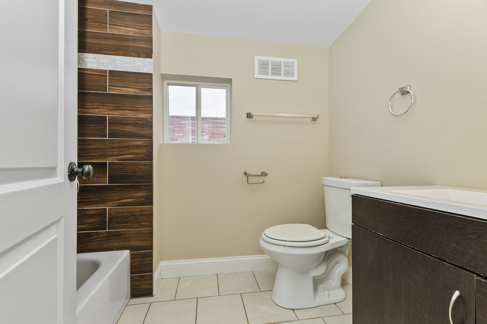 8317 South Merrill Avenue Chicago, IL 60617 - Photo 14 of 23 a bathroom with a toilet and a shower