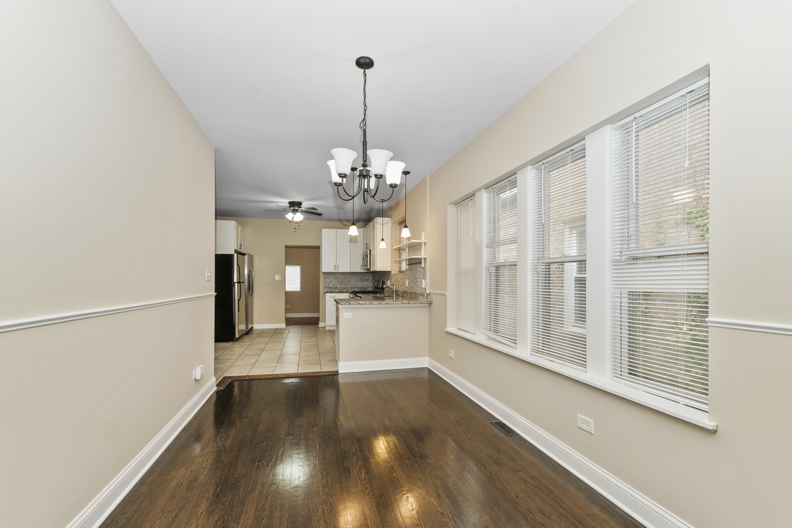 8317 South Merrill Avenue Chicago, IL 60617 - Photo 3 of 23 a view of a room with wooden floor