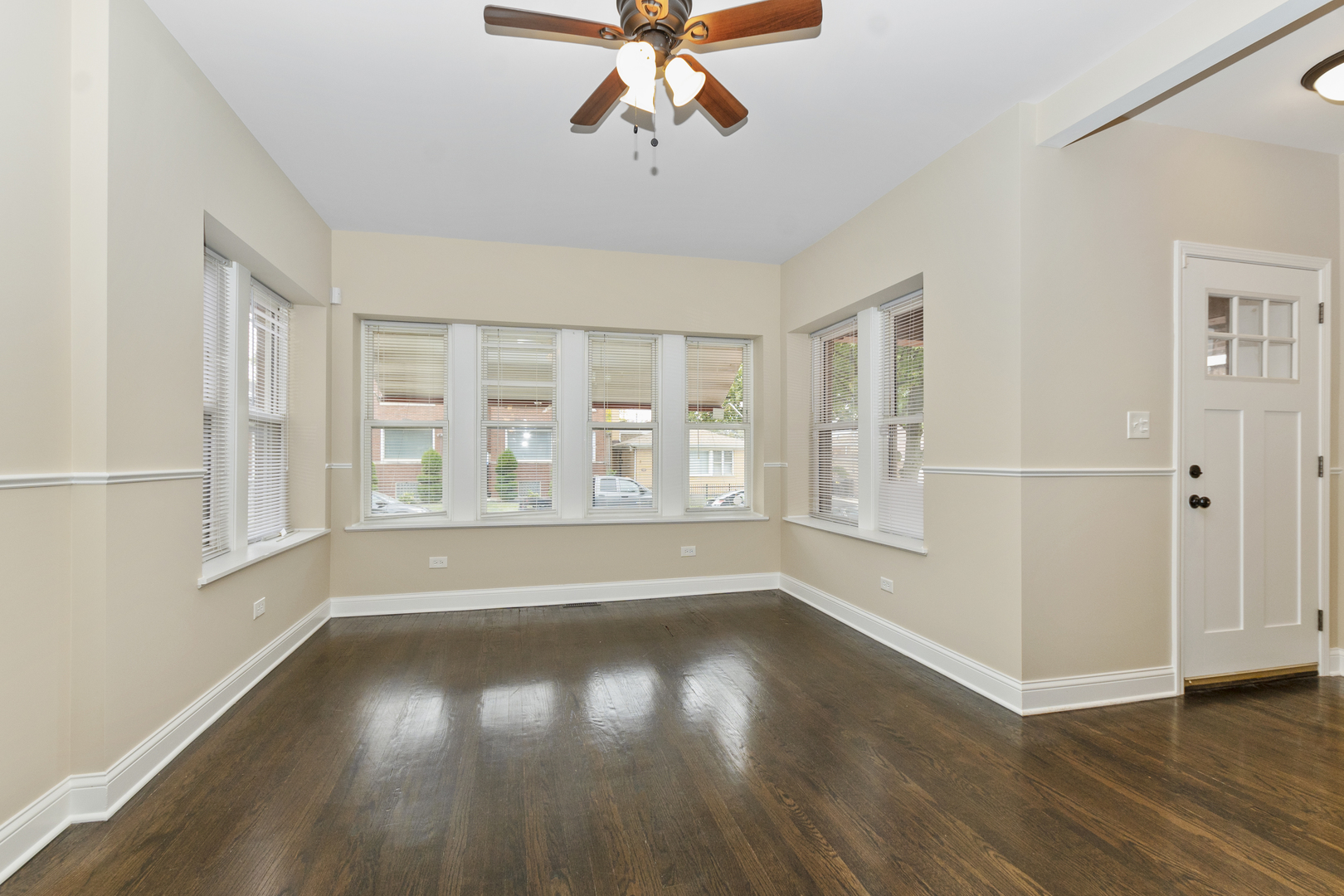 8317 South Merrill Avenue Chicago, IL 60617 - Photo 4 of 23 wooden floor in an empty room with a window
