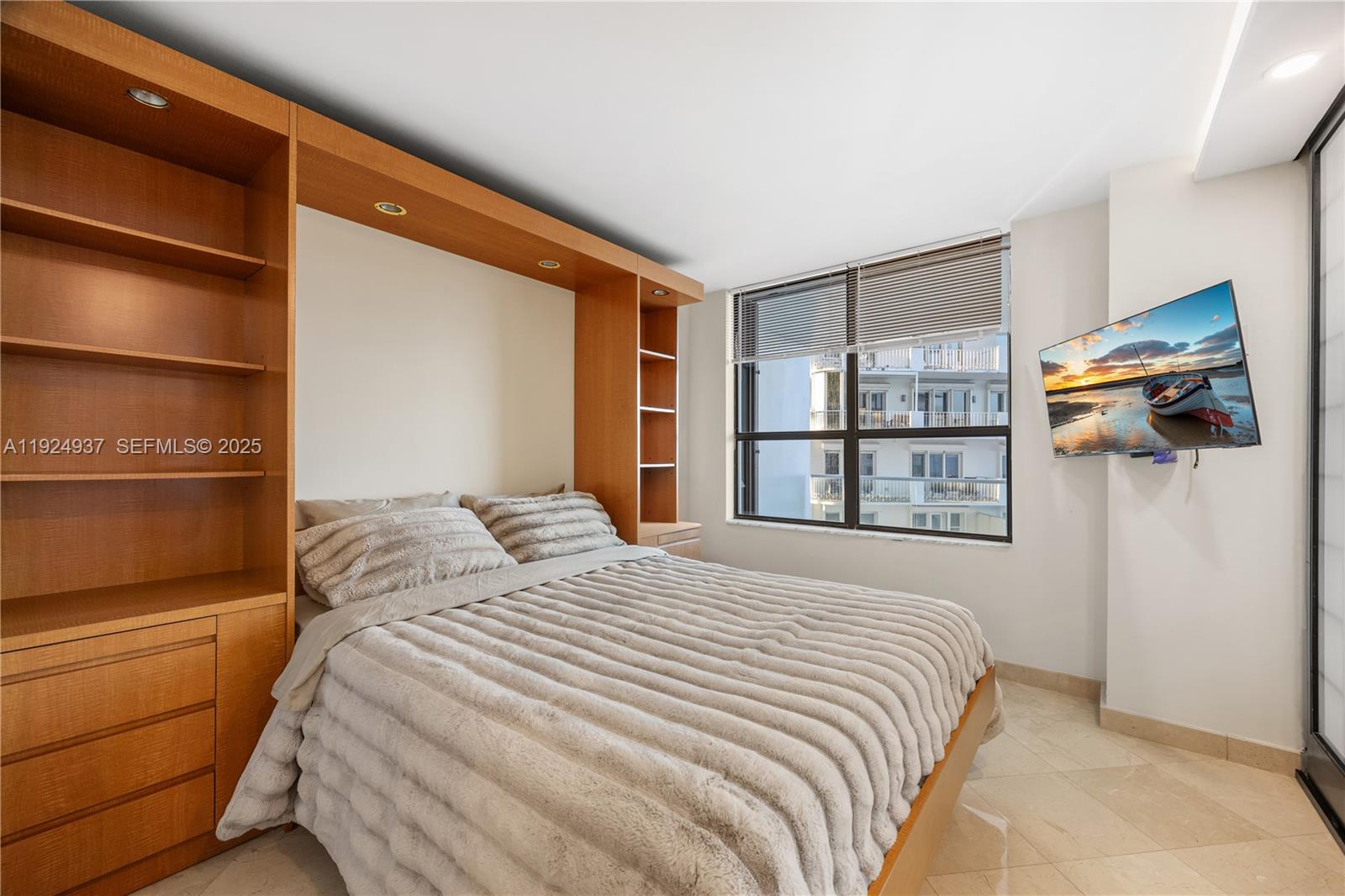 9801 Collins Avenue, Unit 10G Bal Harbour, FL 33154 - Photo 19 of 34 a bedroom with a bed and a window