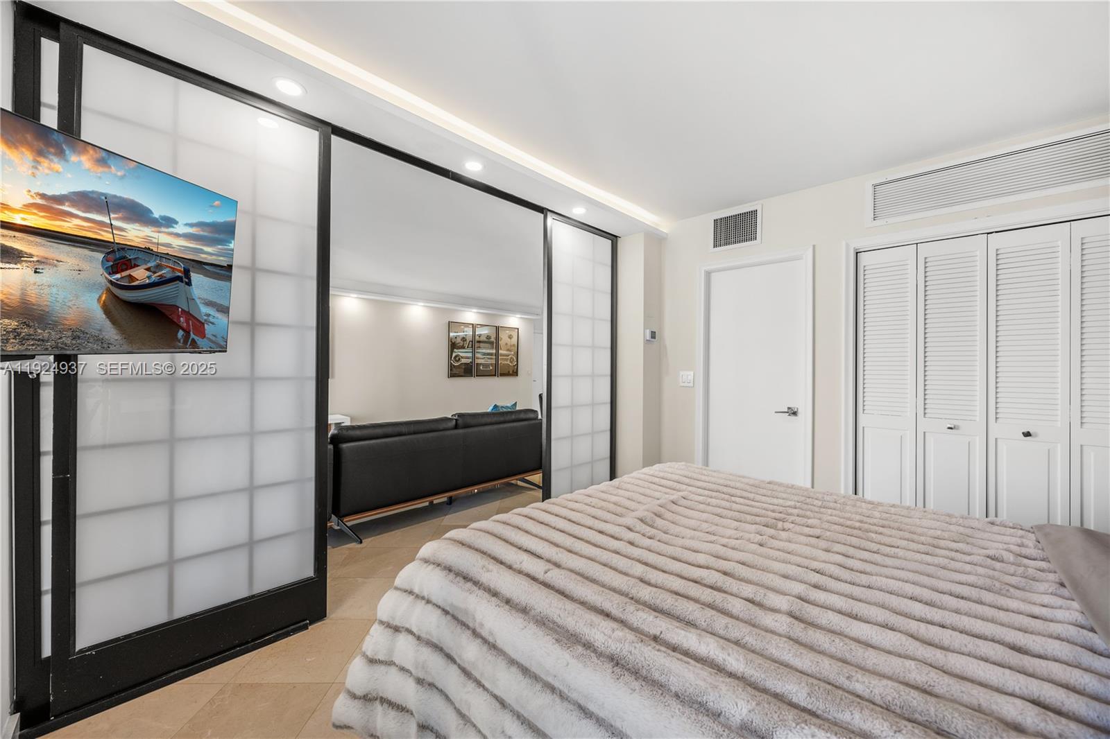 9801 Collins Avenue, Unit 10G Bal Harbour, FL 33154 - Photo 20 of 34 a bedroom with a bed and walk in closet