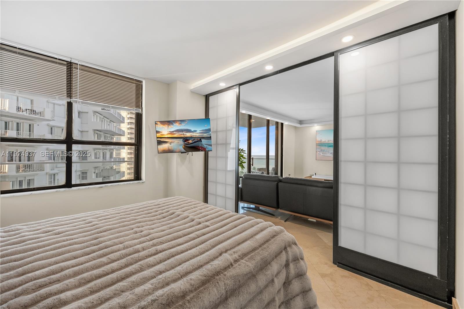 9801 Collins Avenue, Unit 10G Bal Harbour, FL 33154 - Photo 21 of 34 a bedroom with a bed next to a window