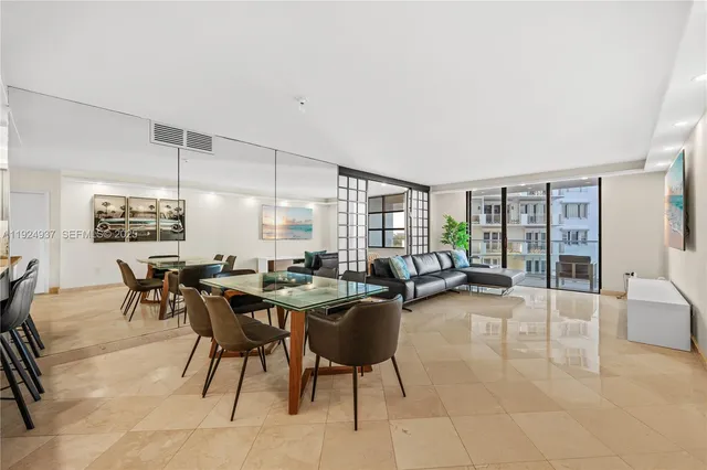 a living room with furniture and a table