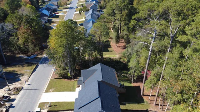 an aerial view of house with yard