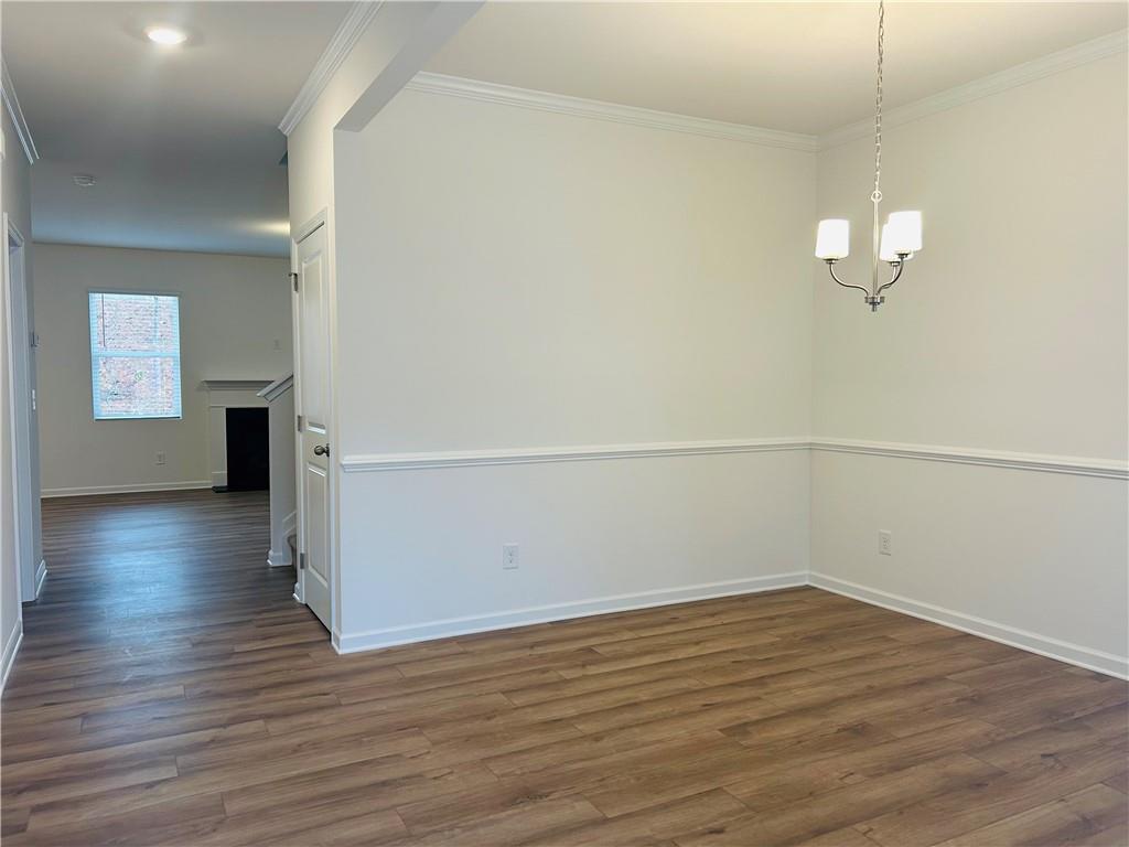 137 Bloomfield Circle Canton, GA 30114 - Photo 3 of 14 a view of a room with wooden floor and window