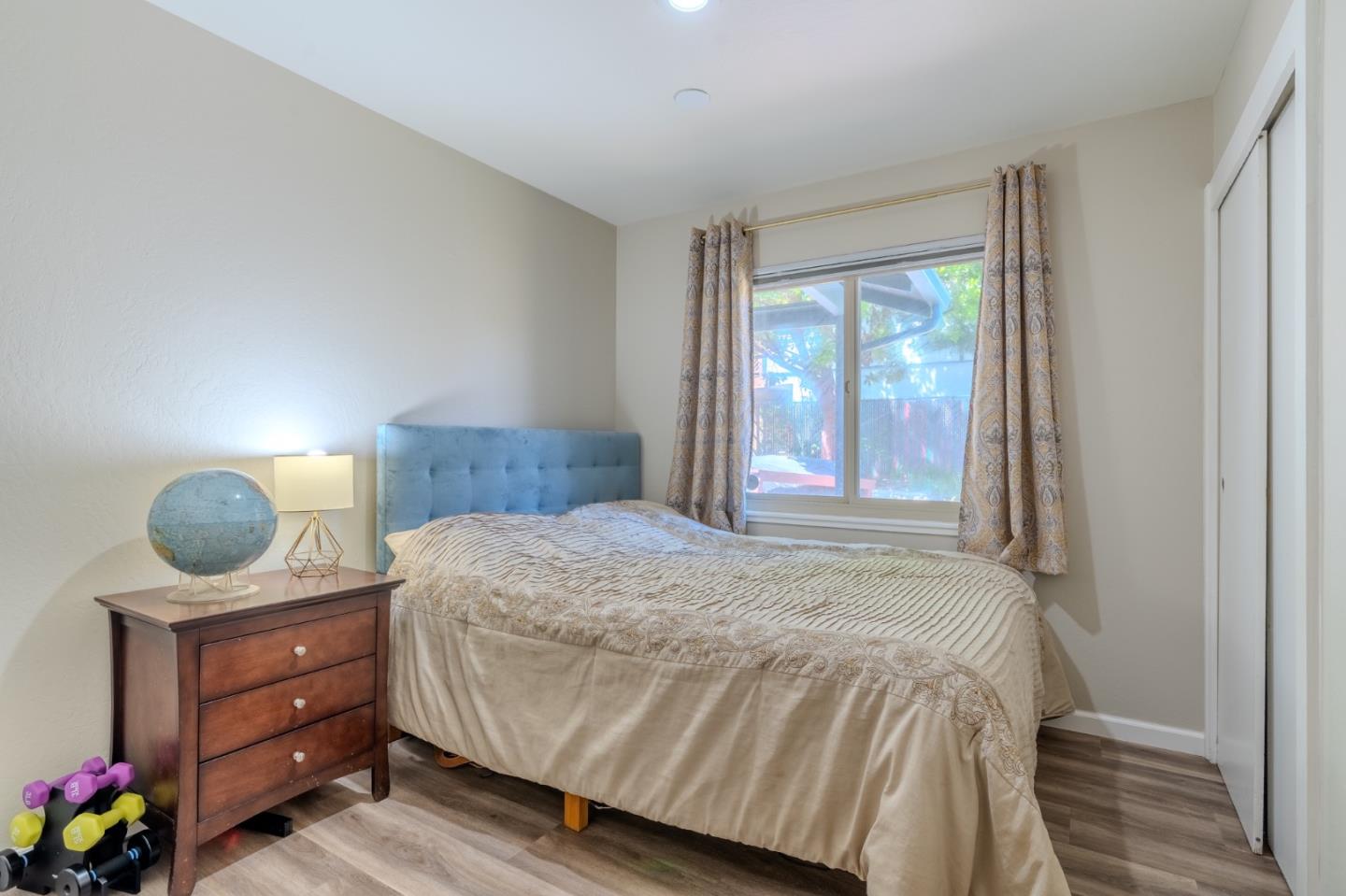 1327 Crespi Drive Pacifica, CA 94044 - Photo 19 of 48 a bedroom with a bed and a dresser