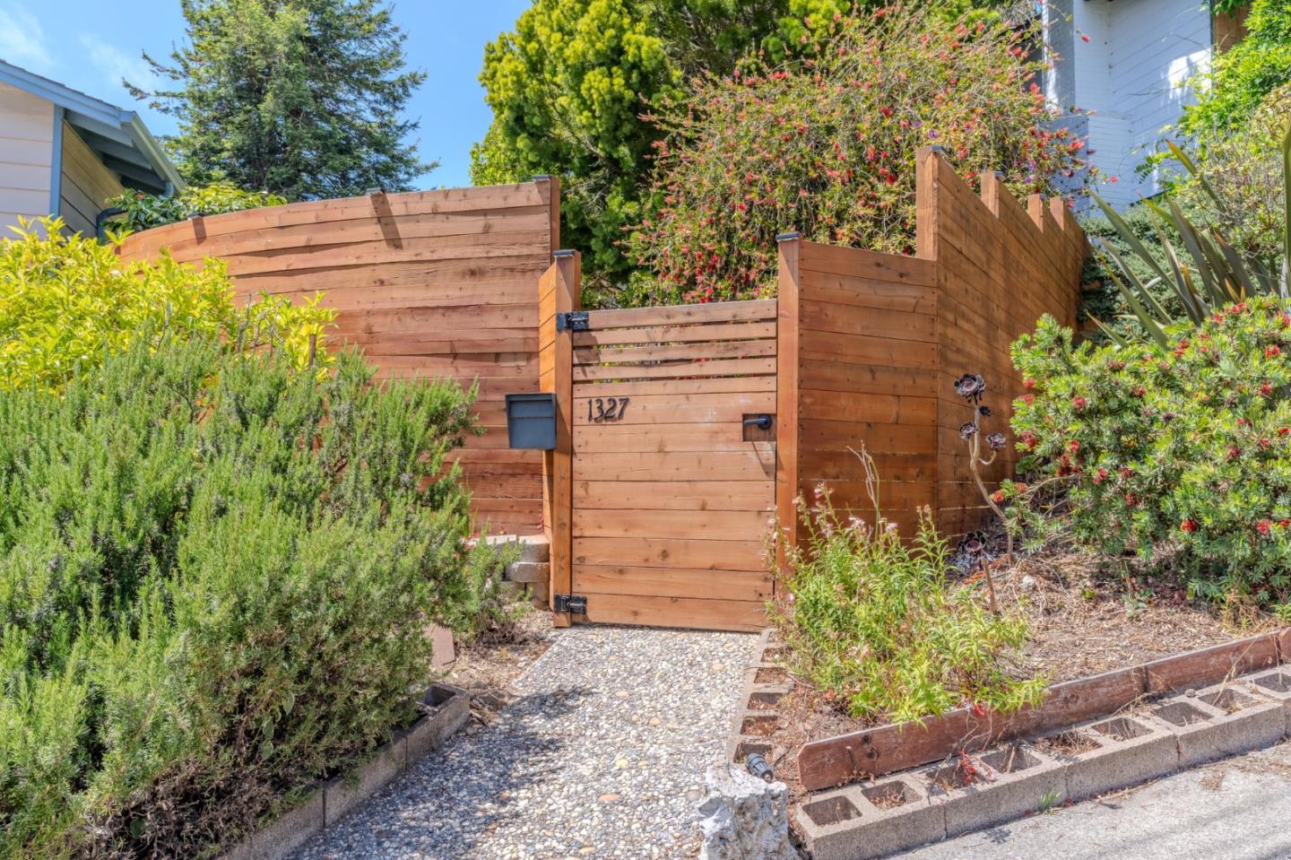 1327 Crespi Drive Pacifica, CA 94044 - Photo 2 of 48 a view of a wooden house and garden