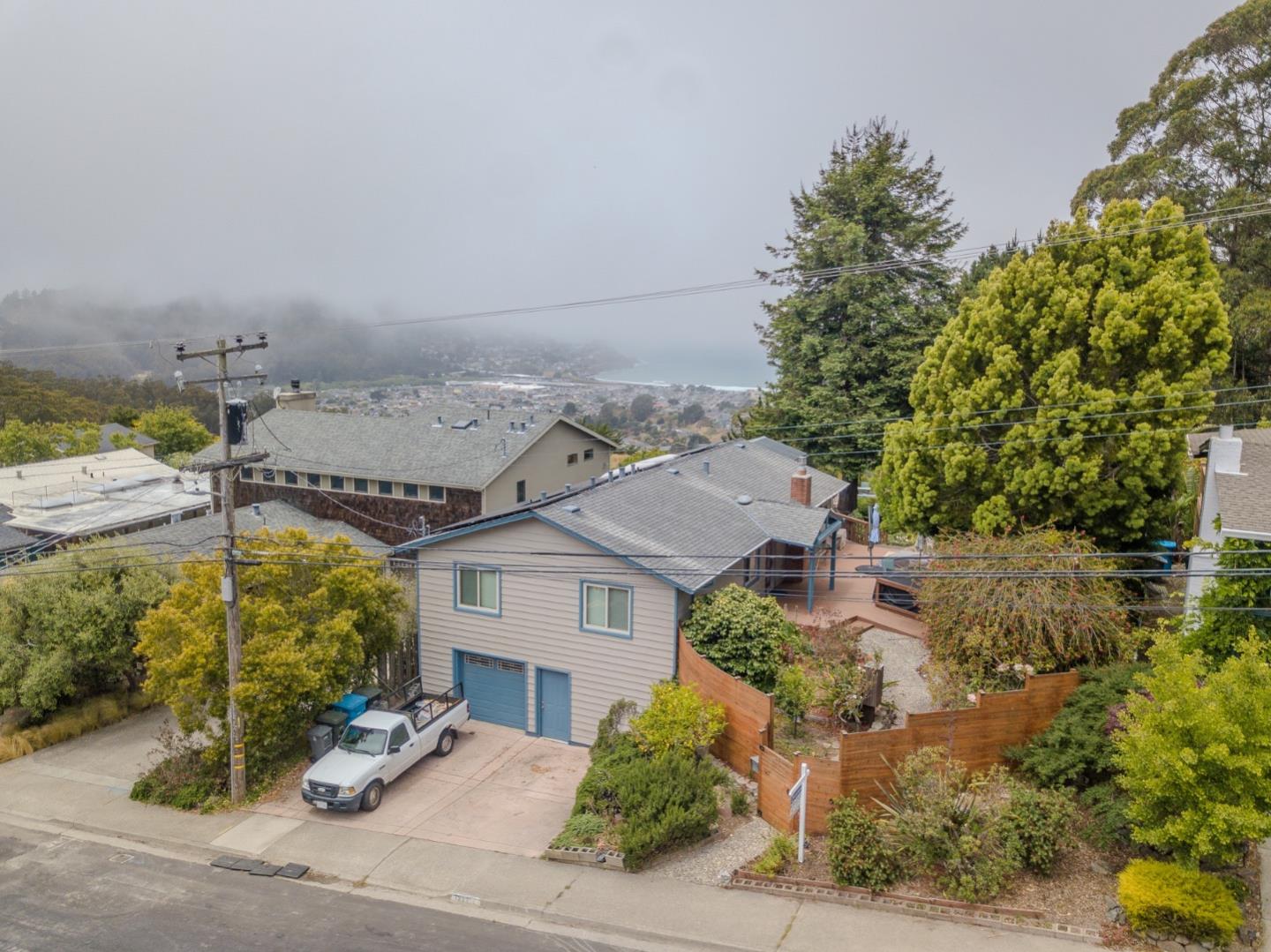 1327 Crespi Drive Pacifica, CA 94044 - Photo 42 of 48 an aerial view of a house with yard ocean and mountain view in back