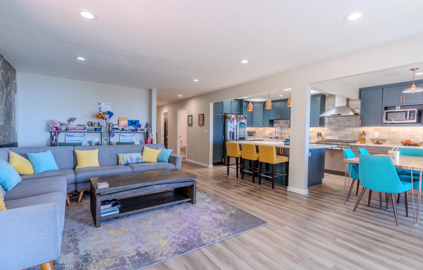 1327 Crespi Drive Pacifica, CA 94044 - Photo 9 of 48 a living room with furniture and a dining table with kitchen view