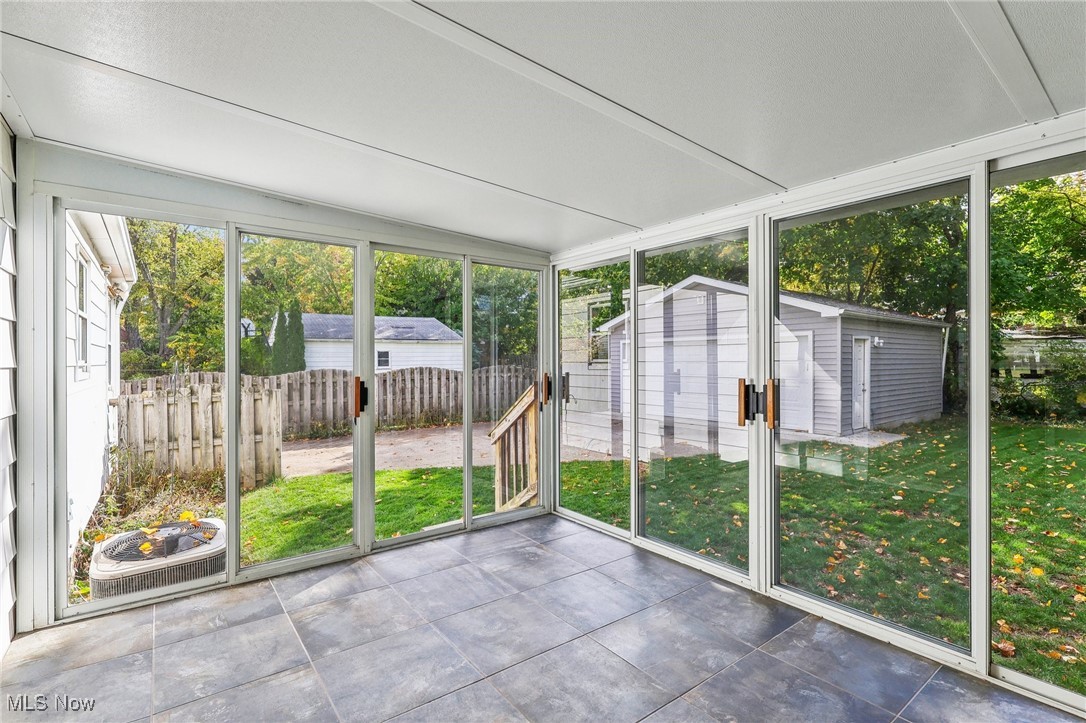 4476 College Road South Euclid, OH 44121 - Photo 31 of 42 Unfurnished sunroom with lofted ceiling