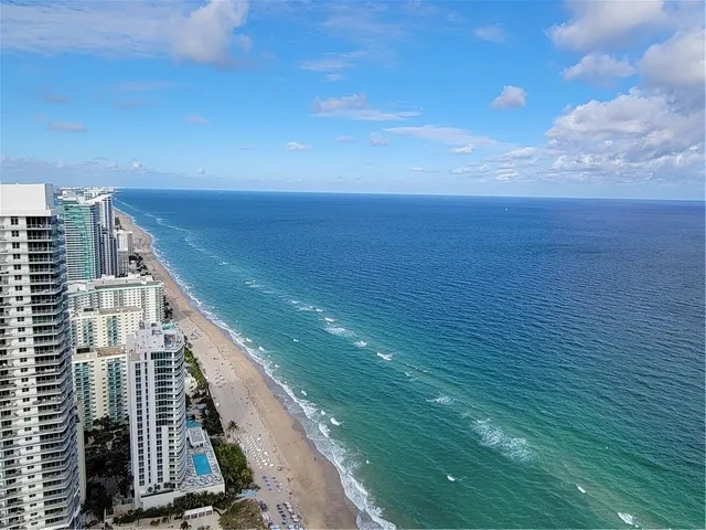 a view of city with ocean