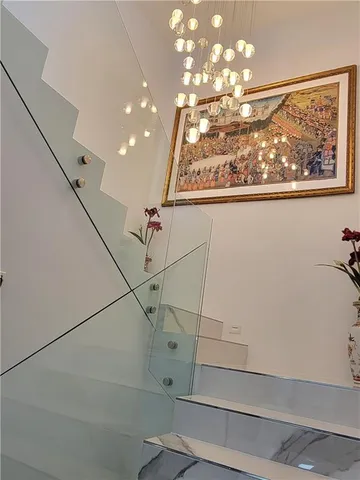 a view of a room with window and chandelier