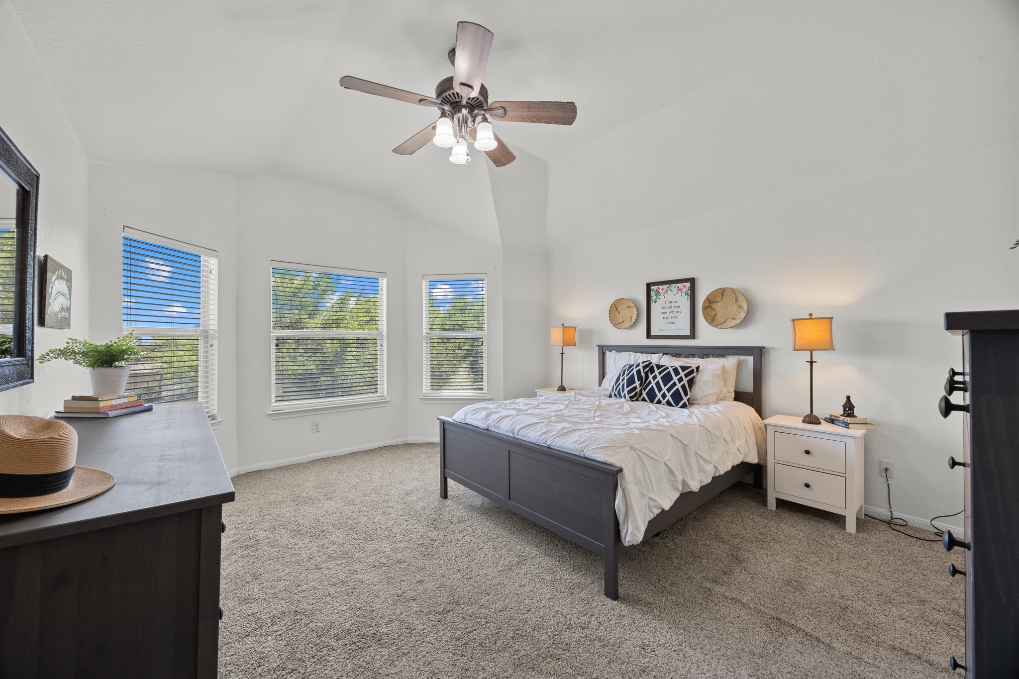 17833 Madden Drive Pflugerville, TX 78660 - Photo 11 of 21 a bedroom with a bed and a chandelier