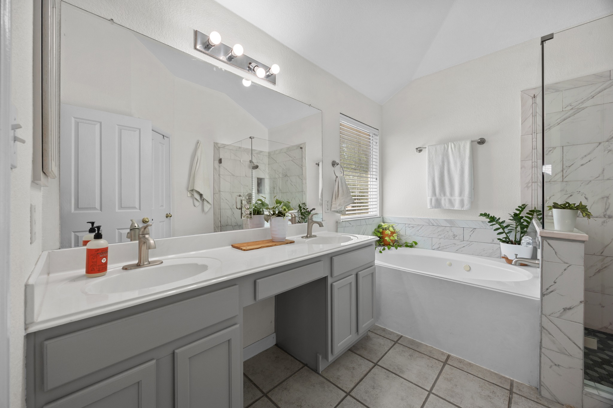 17833 Madden Drive Pflugerville, TX 78660 - Photo 13 of 21 a bathroom with a sink double vanity and a mirror