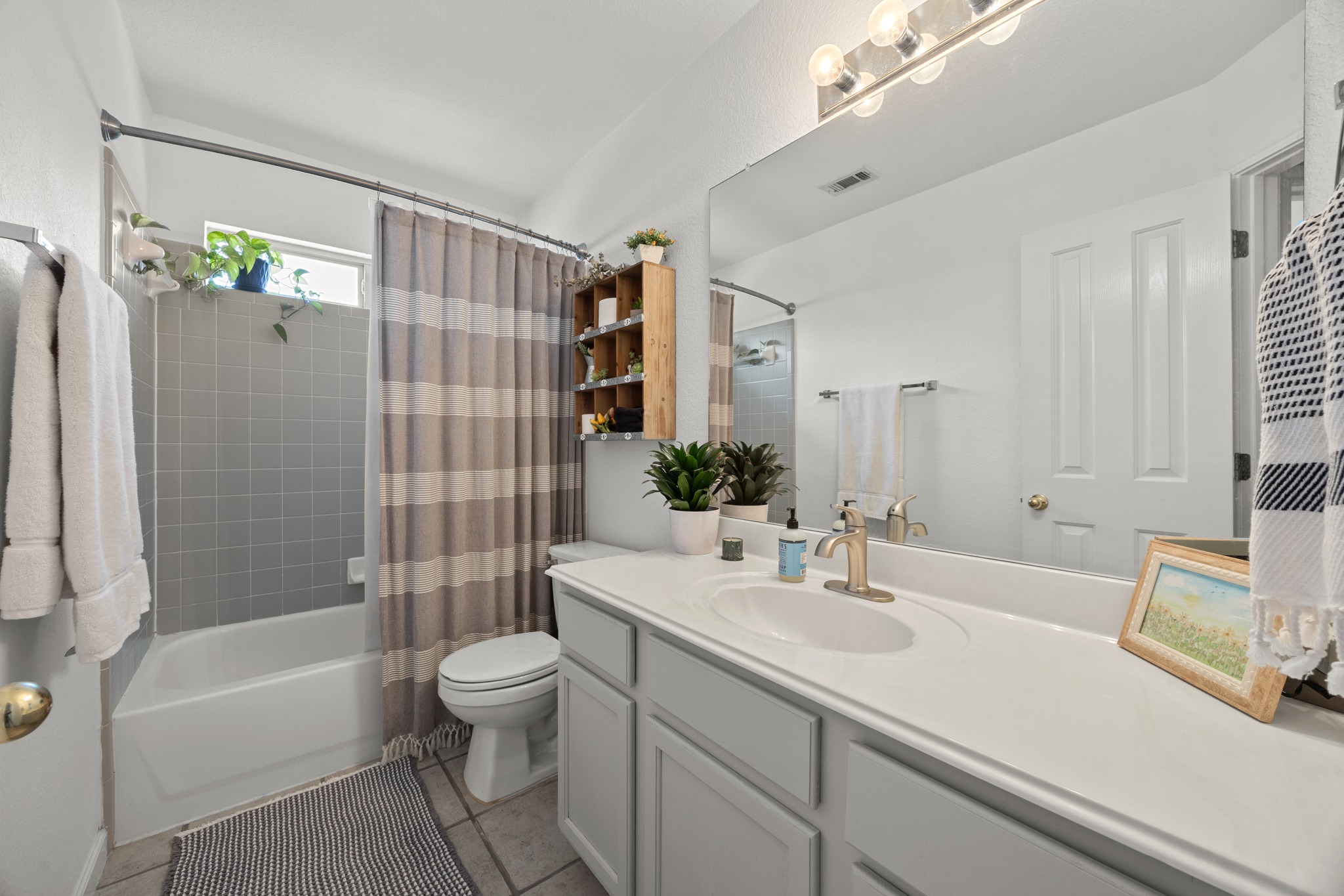 17833 Madden Drive Pflugerville, TX 78660 - Photo 15 of 21 a bathroom with a sink a toilet and shower