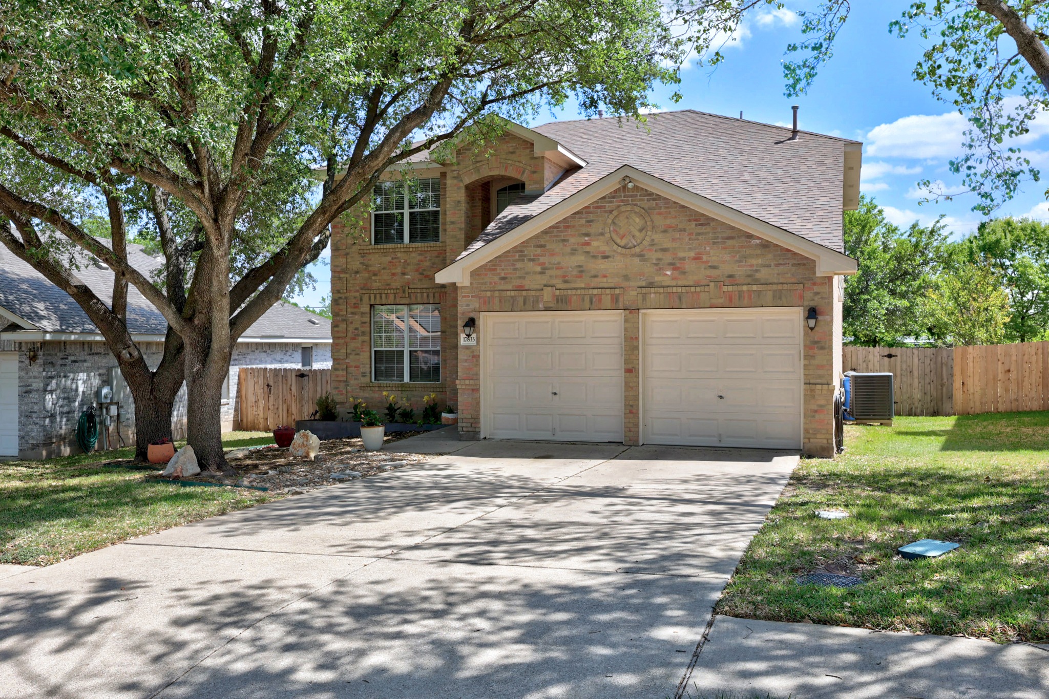17833 Madden Drive Pflugerville, TX 78660 - Photo 17 of 21 a view of a house with a yard and large tree