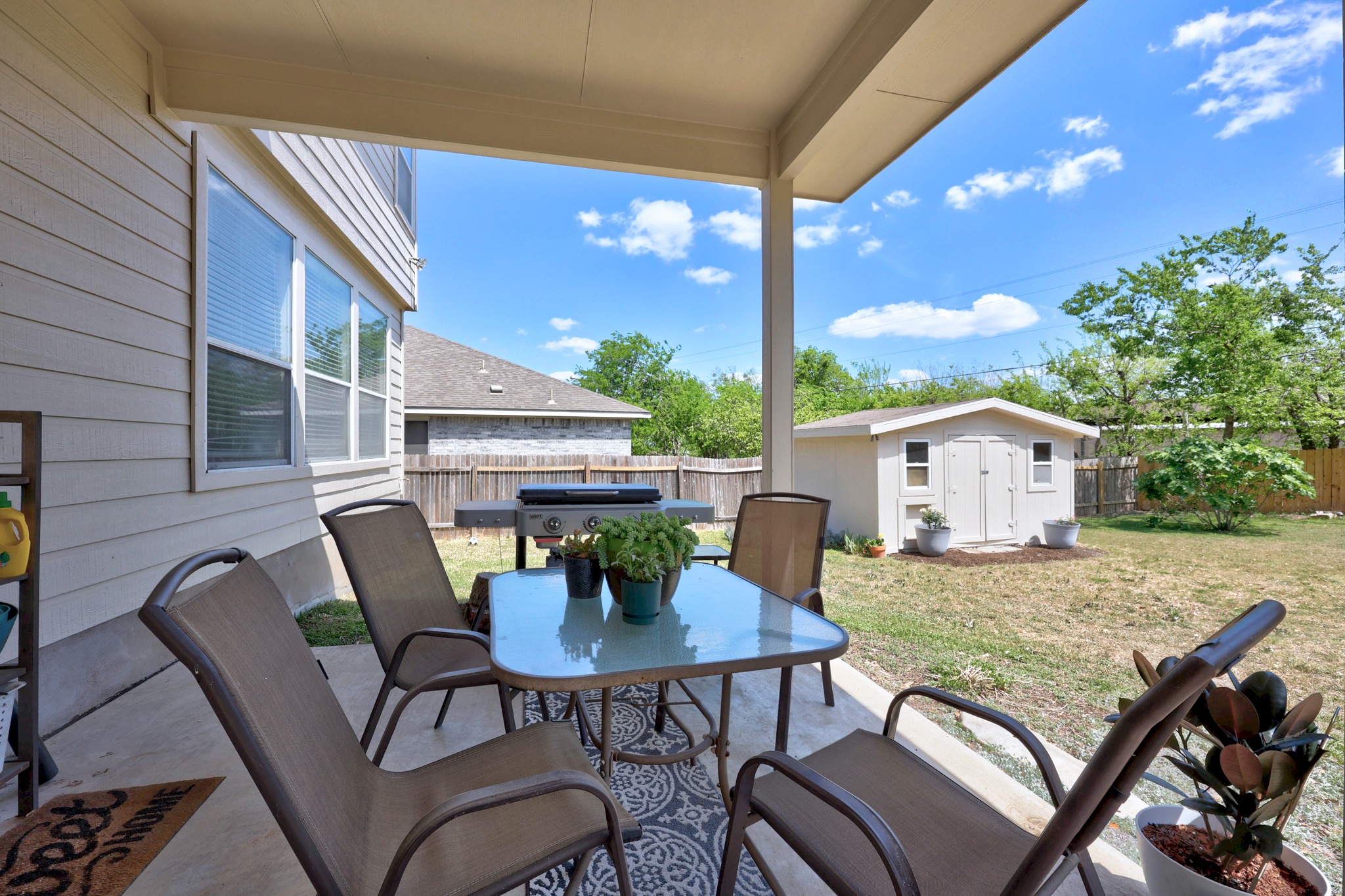 17833 Madden Drive Pflugerville, TX 78660 - Photo 18 of 21 a view of a patio with a table and chairs
