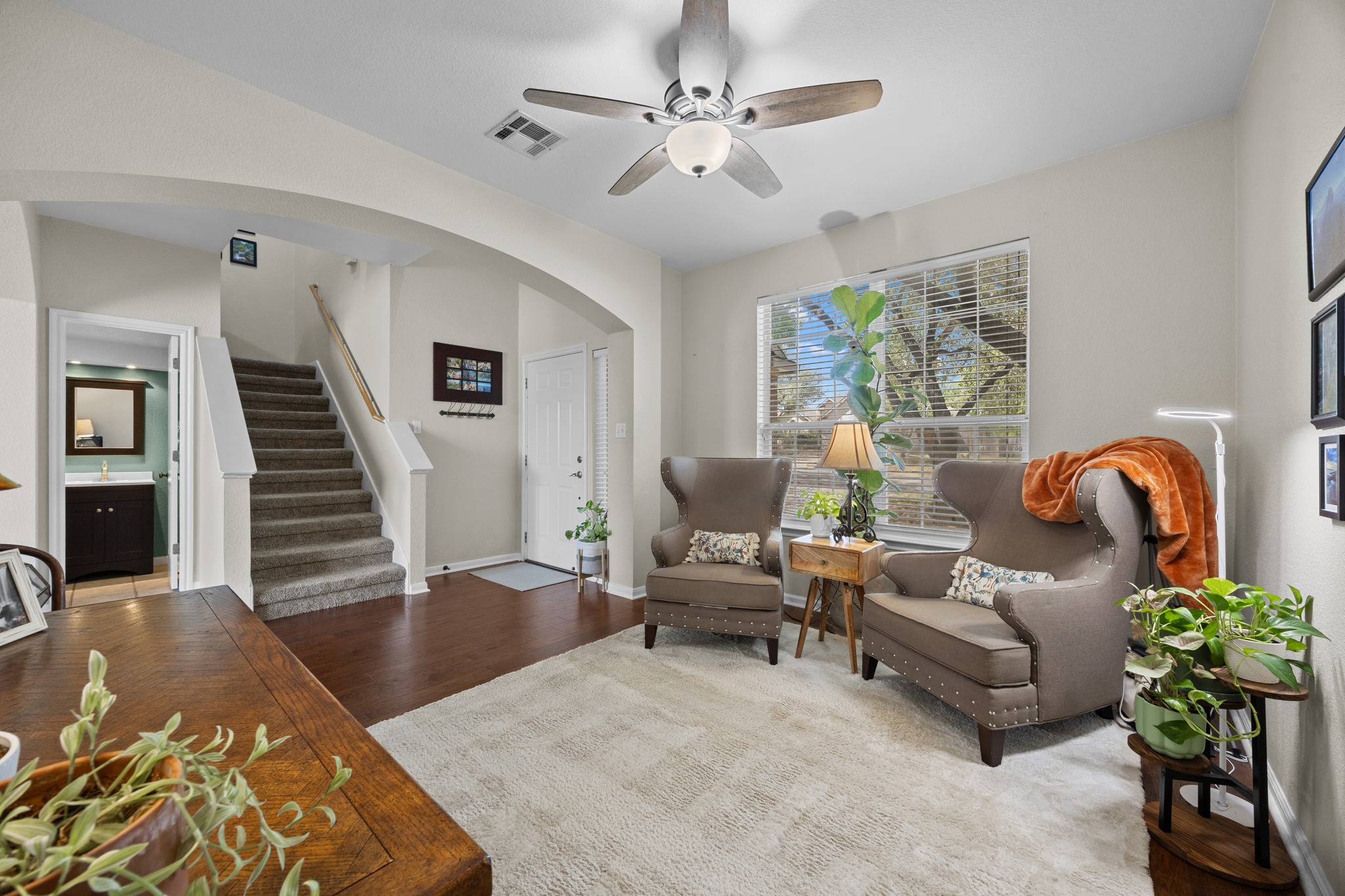 17833 Madden Drive Pflugerville, TX 78660 - Photo 2 of 21 a living room with furniture and wooden floor