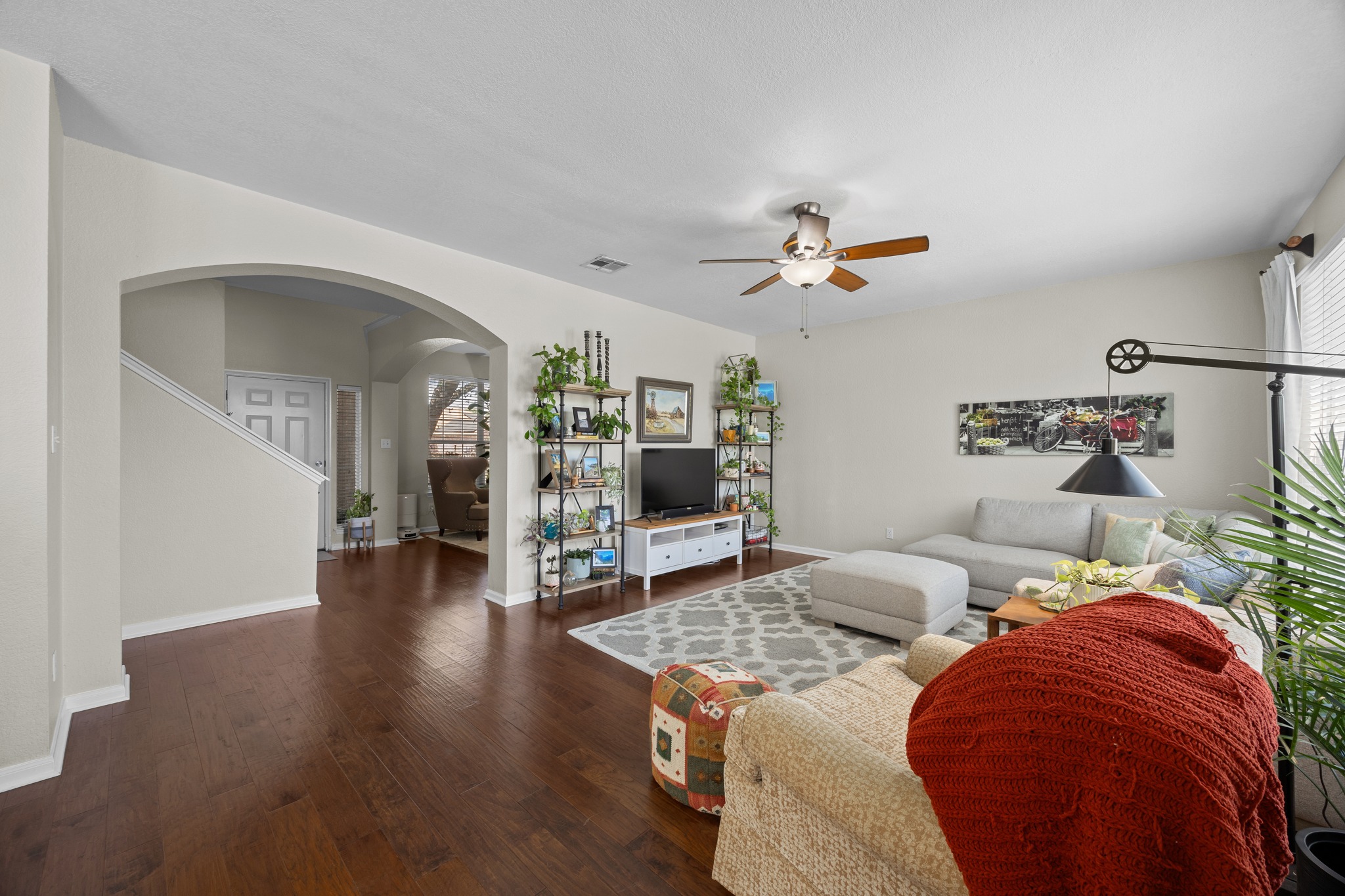 17833 Madden Drive Pflugerville, TX 78660 - Photo 3 of 21 a living room with furniture and a ceiling fan