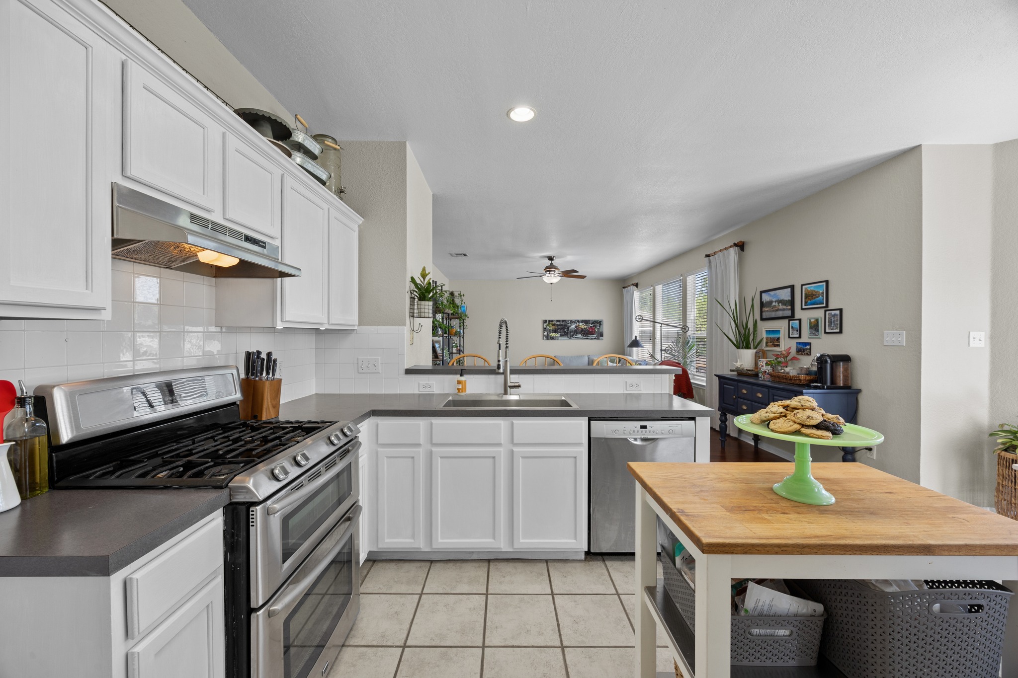 17833 Madden Drive Pflugerville, TX 78660 - Photo 5 of 21 a kitchen with a sink stove and cabinets