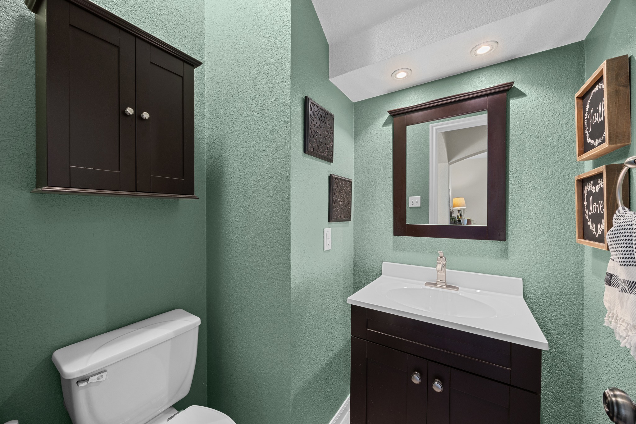 17833 Madden Drive Pflugerville, TX 78660 - Photo 8 of 21 a bathroom with a toilet sink and mirror