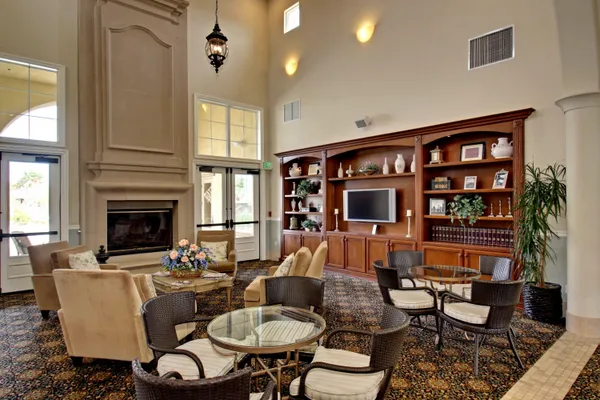 a view of a livingroom with furniture window and wooden floor