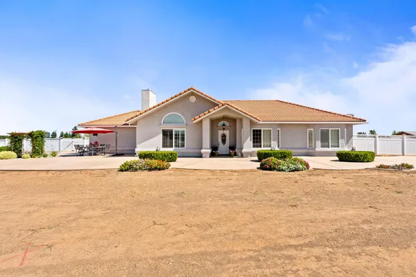 a front view of a house with a patio