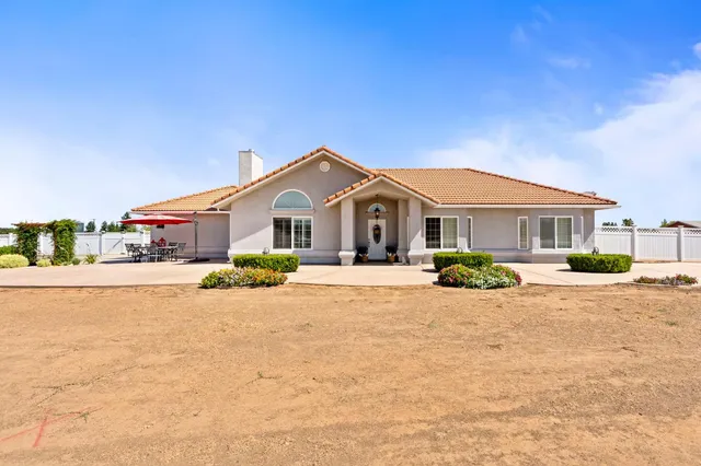 a front view of a house with a patio