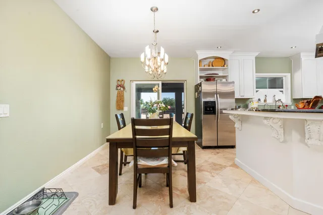 a kitchen with stainless steel appliances granite countertop a stove and a sink