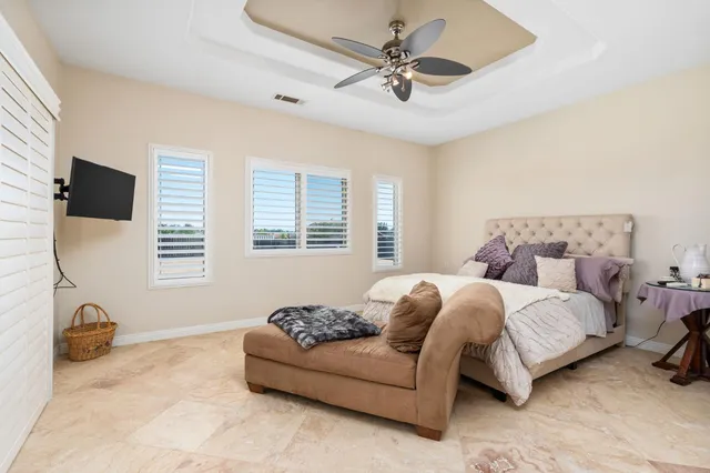 a bedroom with a bed and window