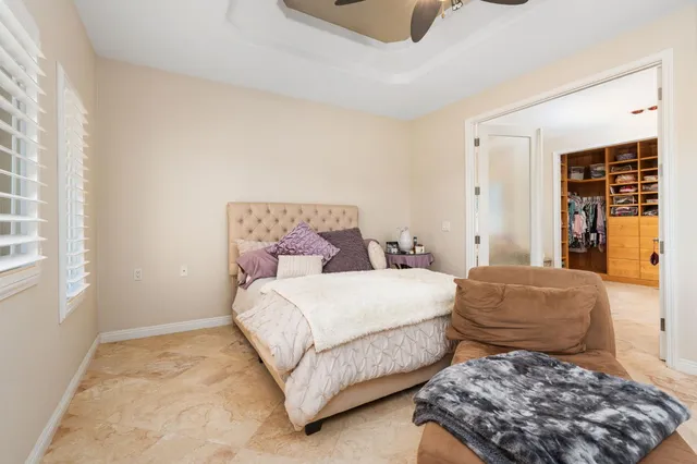 a spacious bathroom with a double vanity sink and mirror